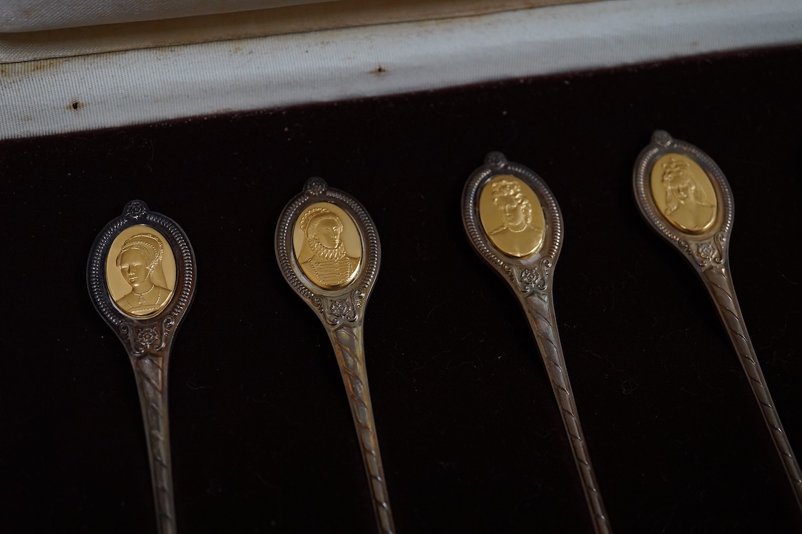 An Elizabeth II cased set of six ‘The Sovereign Queens’ commemorative parcel gilt silver teaspoons by John Pinches, London, 1977.